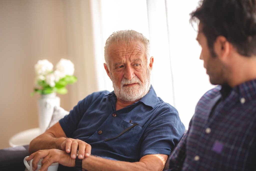 A son and father having a discussion about the seniors drinking